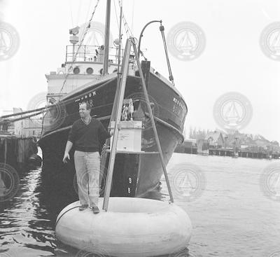 Bill Richardson on buoy in front of R/V Bear.