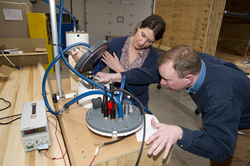 Kate McMonagle and John Lund work on a pCO2 instrument.