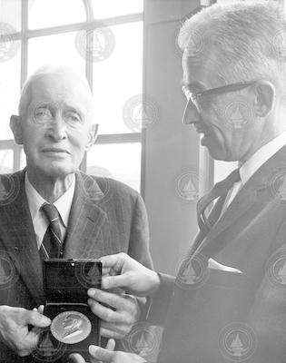 Henry Bigelow and Paul Fye holding the FIRST Bigelow Medal.