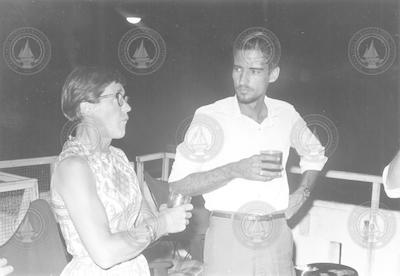 Betty Bunce talking with unidentified man in San Juan.