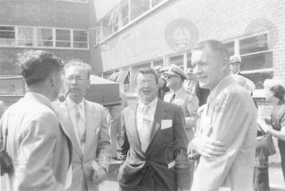 Al Vine and others standing behind Smith building