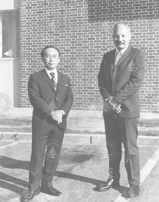 Susumu Honjo and Howard Sanders awaiting arrival of Emperor Hirohito.
