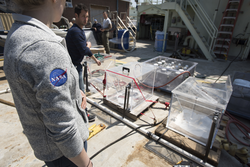 NASA researchers preparing equipment on Atlantis deck for NAAMES expedition.