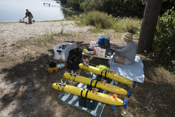 Erin Fischell testing three Bluefin AUVs at Ashumet Pond.