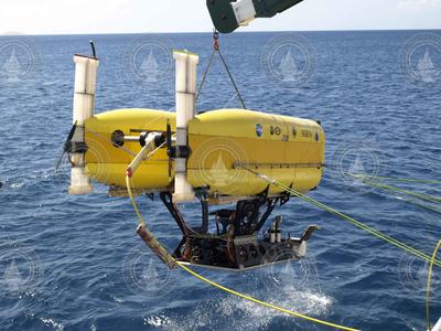 HROV Nereus in ROV mode suspended over the water surface.