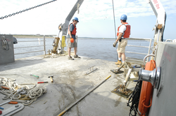 Dave Ralston and Jay Sisson during a mooring recovery.