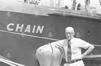 Director Paul M. Fye in front of R/V Chain.