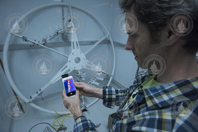 John Reine checks OOI Arctic buoy heater using a thermal camera.