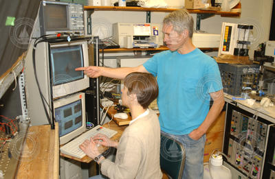 Heidi Sosik and Rob Olson working in the lab.