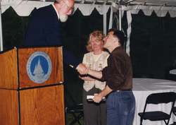 John Farrington and Judy McDowell congratulating Dan Goldner.