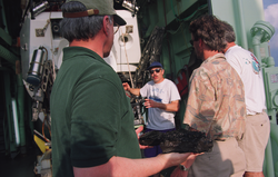 Jim Cochran holds a recovered specimen as Dan Fornari discusses it.