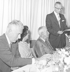 Paul Fye (standing at right) presenting award to Henry Bigelow.