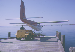 Helio Courier aircraft taking off from Dyer's Dock ramp.