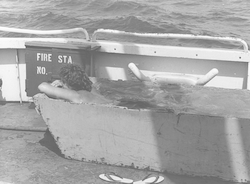 Charles Hollister cooling off aboard a ship