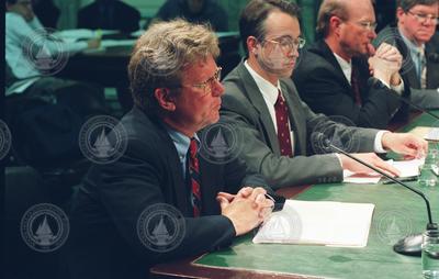 Bill Curry and other panelists testifying at a Senate committee hearing