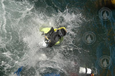 Divers aboard Tioga jump in the water at the MVCO.
