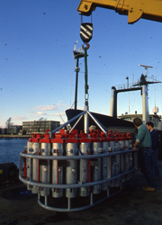 Jim Broda with explosives carrier at the WHOI dock.