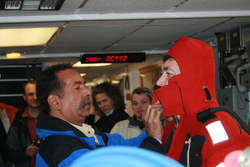 Diego Mello helping Tim Shanahan into his "gumby suit."