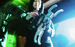 Amy Phung working with an ocean robot manipulator arm.