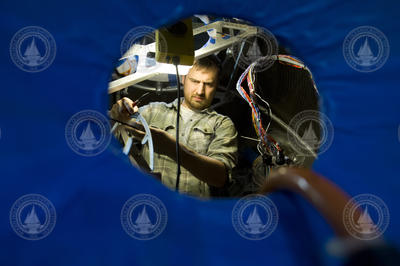 Sean Kelley installing the Alvin personnel sphere wiring harness.