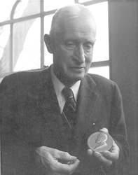 Henry Bigelow holding the Bigelow Medal