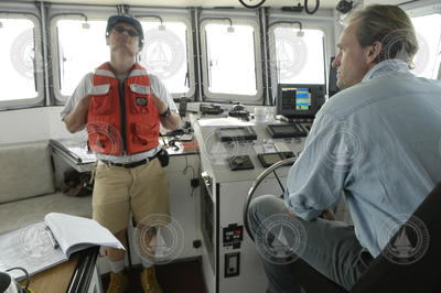 Jay Sisson and Tioga Captain Ken Houtler on the bridge