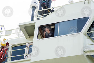 Captain Derek Bergeron looks out a starboard window from the bridge.