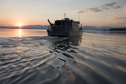 Research Vessel Annie is piloted out into Yellowstone Lake.