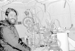 Unidentified man in lab below deck of Gosnold