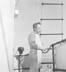 Eugene Mysona aboard unidentified ship at dock.