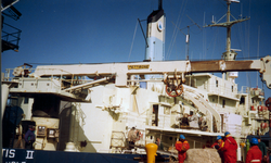 Atlantis II at dock, large crane
