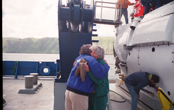 Charley Hollister hugs Lisina Hoch, Alvin on right