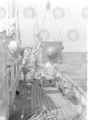 People on deck of Atlantis with shot camera.