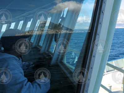 Captain Diego Mello looking out forward from the bridge.