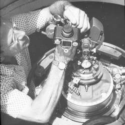 William von Arx working with theodolite.