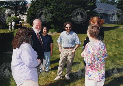 John Farrington talking with a group of students at 1998 Graduate Reception.