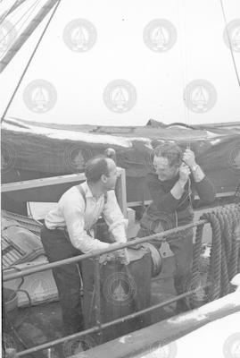 Two men on deck of the Anton Dohrn in the winter