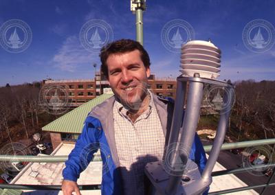 Jim Edson holding an air-sea sensor.
