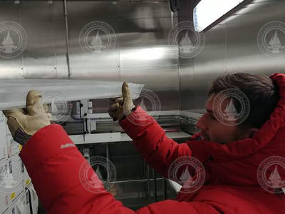 Matt Osman holding a 2,000-year-old ice core.