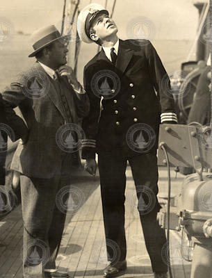 Columbus Iselin (right) in uniform on deck of Atlantis.