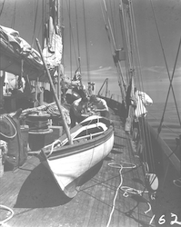 Captain Adrian Lane working on dinghy on deck