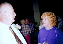 Bill Dunkle talking with Ginny McKinnon at his retirement party.