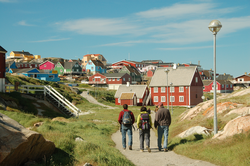 Chris Linder, Sarah Das, and Ian Joughin strolling into Ilulissat, Greenland.