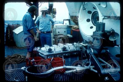 Ken Buesseler (right) and another researcher load gear onto Alvin.