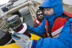 Sean Kelley and Justin Fujii preparing AUV Sentry for dock tests.