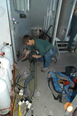 Heidi Sosik works on the power supply for the flow cytometer.