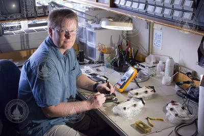 Engineer Tom Hurst in lab working with DTAGs.