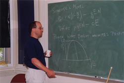 Mike Neubert at chalkboard.
