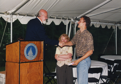 John Farrington and Judy McDowell congratulating Gaspar T. Oldenburg.
