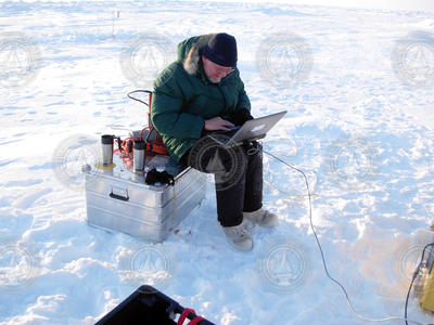 Rick Krishfield checking equipment operation on a laptop.